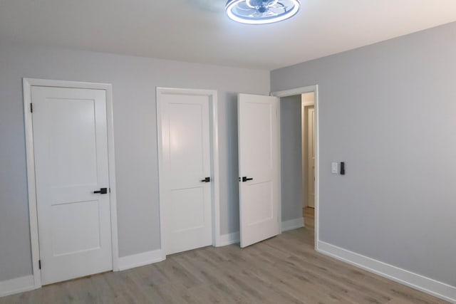 369 Ferndale Ct Unit B1, Schaumburg, IL 60193 - unfurnished bedroom featuring light wood finished floors and baseboards