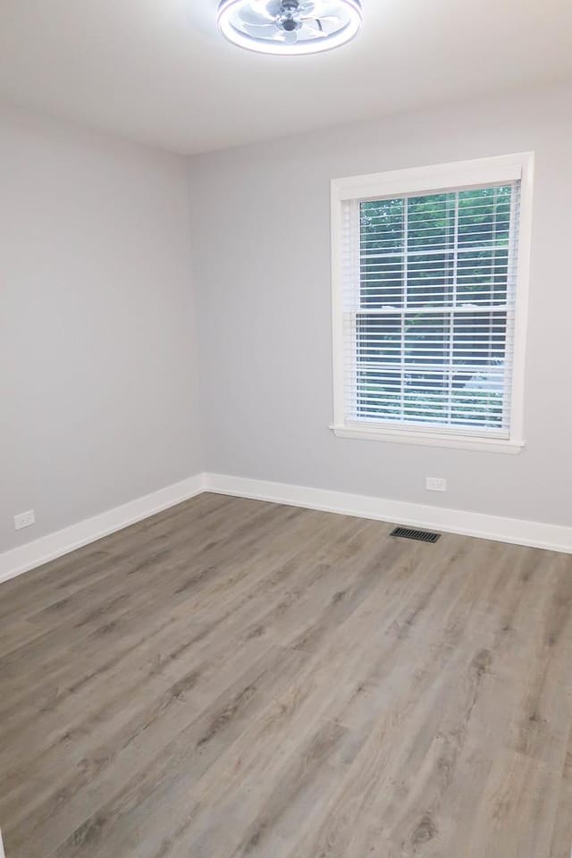 369 Ferndale Ct Unit B1, Schaumburg, IL 60193 - unfurnished room with wood finished floors and baseboards