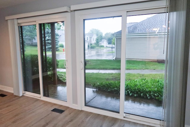 369 Ferndale Ct Unit B1, Schaumburg, IL 60193 - doorway to outside featuring wood finished floors and a water view