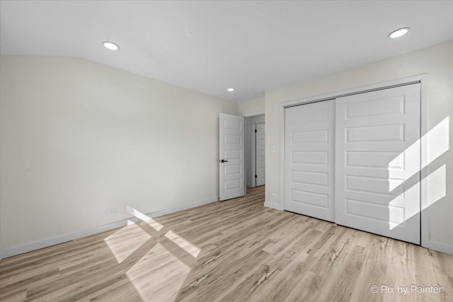 215 Brighton Rd, Elk Grove Village, IL 60007 - unfurnished bedroom with wood finished floors, a closet, and recessed lighting