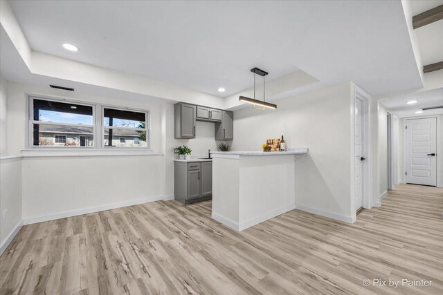 215 Brighton Rd, Elk Grove Village, IL 60007 - kitchen with gray cabinets, light wood-type flooring, light countertops, recessed lighting, and a peninsula