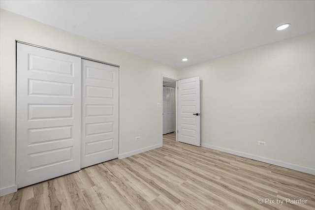 215 Brighton Rd, Elk Grove Village, IL 60007 - unfurnished bedroom featuring wood finished floors, a closet, and recessed lighting