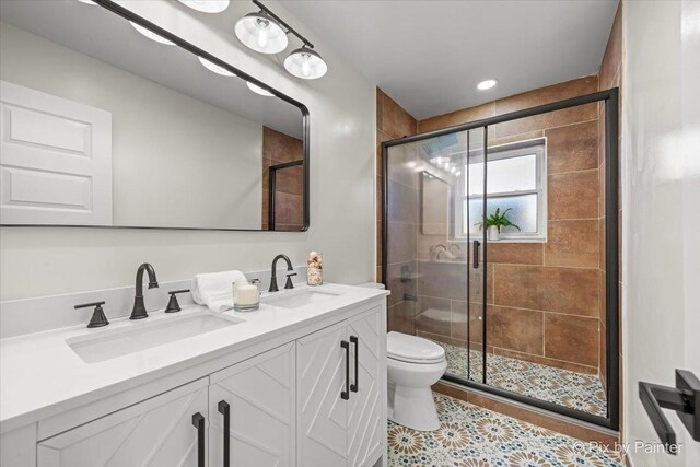215 Brighton Rd, Elk Grove Village, IL 60007 - full bath featuring double vanity, a shower stall, and tile patterned floors