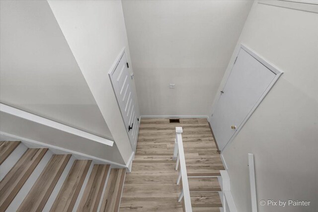 215 Brighton Rd, Elk Grove Village, IL 60007 - stairway with wood finished floors and baseboards