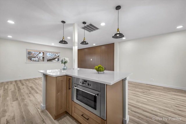 215 Brighton Rd, Elk Grove Village, IL 60007 - kitchen with oven, light wood-style flooring, light countertops, recessed lighting, and decorative light fixtures