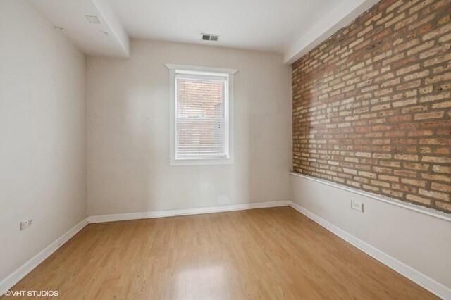 4510 N Ashland Ave Unit Gw, Chicago, IL 60640 - empty room with light wood-style floors and baseboards