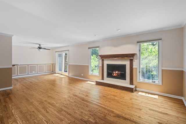 500 W Evergreen St, Wheaton, IL 60187 - unfurnished living room with plenty of natural light, a high end fireplace, wood finished floors, ornamental molding, and ceiling fan