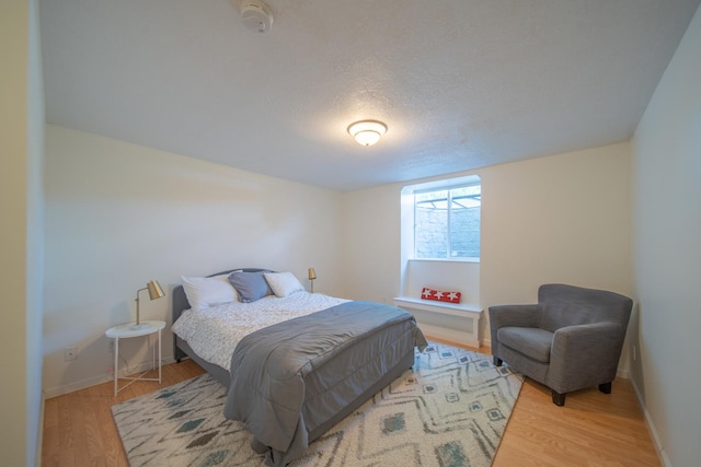 4526 Winn Rd, Sterling, IL 61081 - bedroom with wood finished floors and a textured ceiling