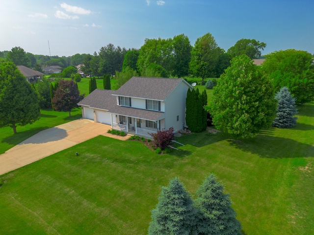 4526 Winn Rd, Sterling, IL 61081 - view of front of property featuring an attached garage, a porch, driveway, a front yard, and stucco siding