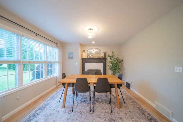4526 Winn Rd, Sterling, IL 61081 - dining area featuring light wood-style flooring and baseboards