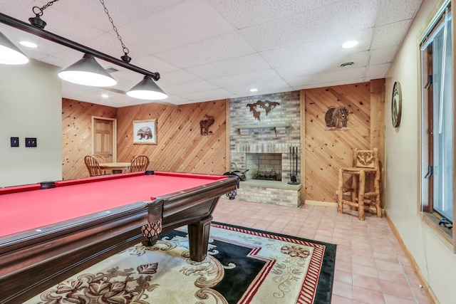 195 Hollow Way, Ingleside, IL 60041 - rec room with wooden walls, billiards, a paneled ceiling, tile patterned flooring, and a brick fireplace