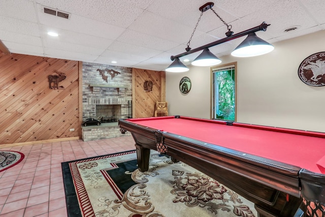 195 Hollow Way, Ingleside, IL 60041 - playroom with wood walls, a brick fireplace, tile patterned flooring, a drop ceiling, and billiards table