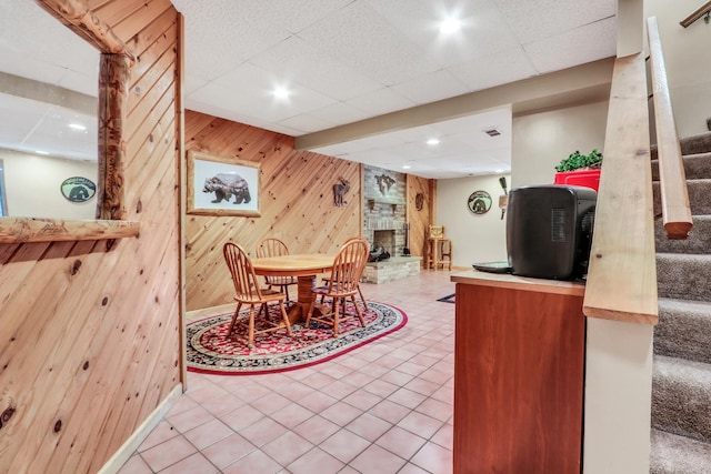 195 Hollow Way, Ingleside, IL 60041 - dining room with stairs, wooden walls, tile patterned floors, a large fireplace, and recessed lighting