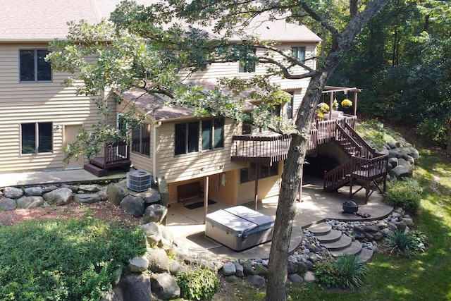 195 Hollow Way, Ingleside, IL 60041 - back of property featuring a patio area, a wooden deck, stairs, and a hot tub