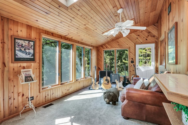 195 Hollow Way, Ingleside, IL 60041 - carpeted living room with wooden walls, lofted ceiling, healthy amount of natural light, wooden ceiling, and ceiling fan