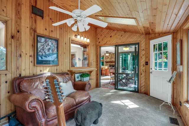195 Hollow Way, Ingleside, IL 60041 - sitting room with wood walls, a ceiling fan, wooden ceiling, carpet floors, and lofted ceiling