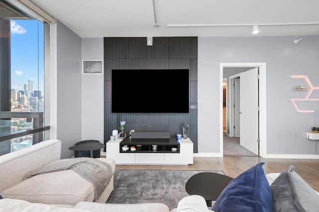 860 W Blackhawk St Unit 2106, Chicago, IL 60642 - living room featuring track lighting and wood finished floors