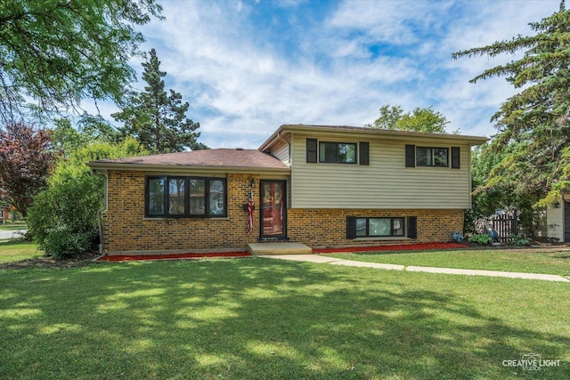 515 W Diversey Ave, Addison, IL 60101 - split level home featuring a front lawn and brick siding