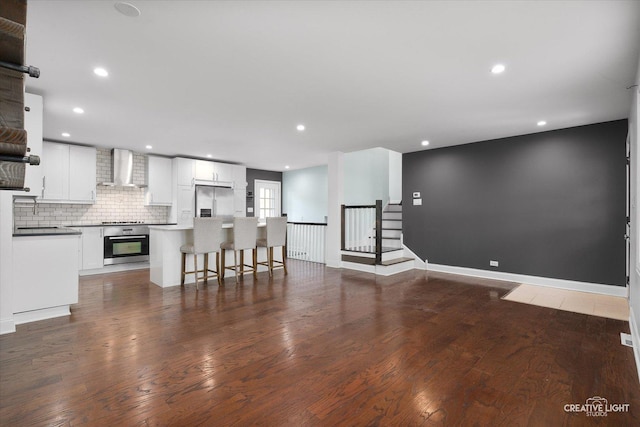 515 W Diversey Ave, Addison, IL 60101 - unfurnished living room featuring wood finished floors and recessed lighting