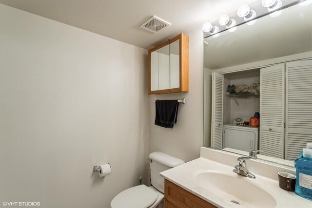 390 S Western Ave Unit 512, Des Plaines, IL 60016 - bathroom featuring vanity, a closet, and washer / clothes dryer
