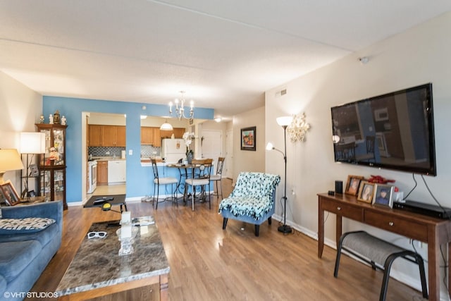 390 S Western Ave Unit 512, Des Plaines, IL 60016 - living area featuring wood finished floors and a chandelier