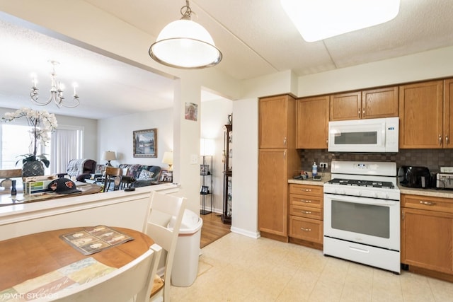 390 S Western Ave Unit 512, Des Plaines, IL 60016 - kitchen with white appliances, brown cabinetry, tasteful backsplash, light countertops, and pendant lighting