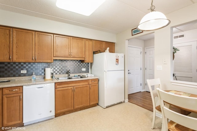 390 S Western Ave Unit 512, Des Plaines, IL 60016 - kitchen featuring white appliances, brown cabinetry, and light countertops