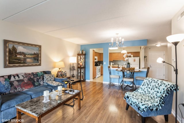 390 S Western Ave Unit 512, Des Plaines, IL 60016 - living room featuring a chandelier and light wood-type flooring