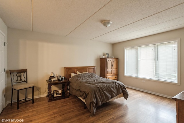 390 S Western Ave Unit 512, Des Plaines, IL 60016 - bedroom featuring wood finished floors and a textured ceiling