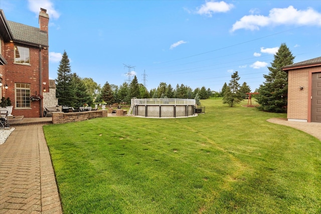 11010 W 131st St, Palos Park, IL 60464 - view of grassy yard with an outdoor pool and a patio area
