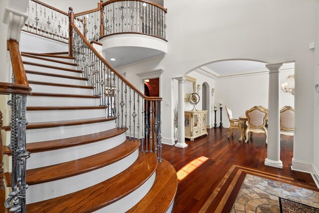 11010 W 131st St, Palos Park, IL 60464 - foyer featuring arched walkways, a high ceiling, hardwood / wood-style floors, decorative columns, and stairs