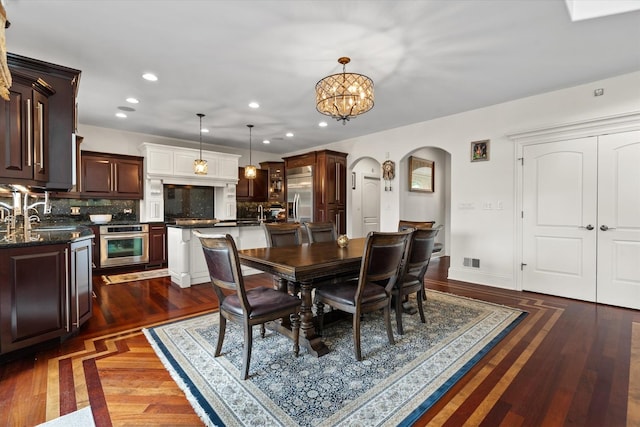 11010 W 131st St, Palos Park, IL 60464 - dining room with arched walkways, recessed lighting, a chandelier, and dark wood-style flooring