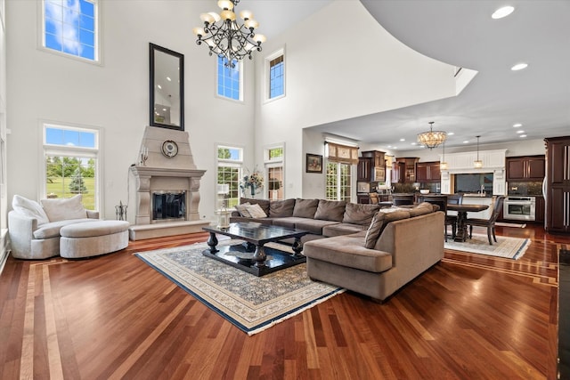 11010 W 131st St, Palos Park, IL 60464 - living area featuring a chandelier, dark wood-style floors, recessed lighting, a fireplace, and a towering ceiling