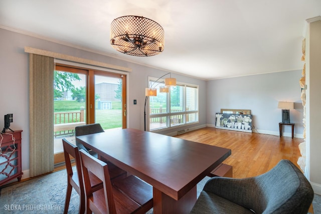 21W724 Park Ave, Lombard, IL 60148 - dining room featuring crown molding and light wood-style flooring