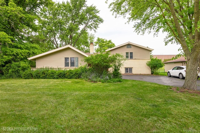 21W724 Park Ave, Lombard, IL 60148 - rear view of house with a chimney and a yard