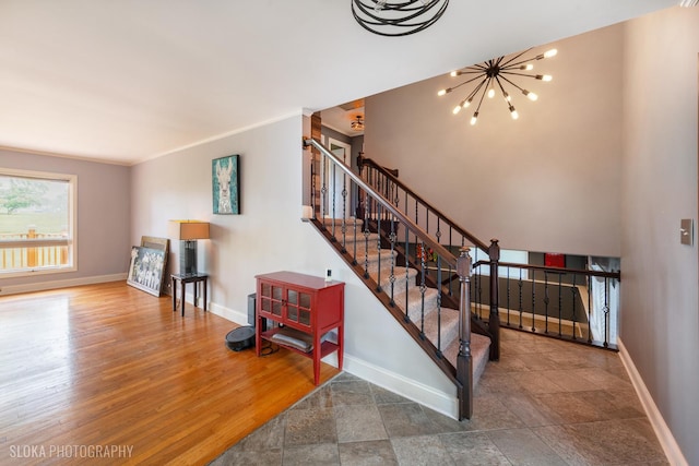 21W724 Park Ave, Lombard, IL 60148 - staircase featuring baseboards and a chandelier