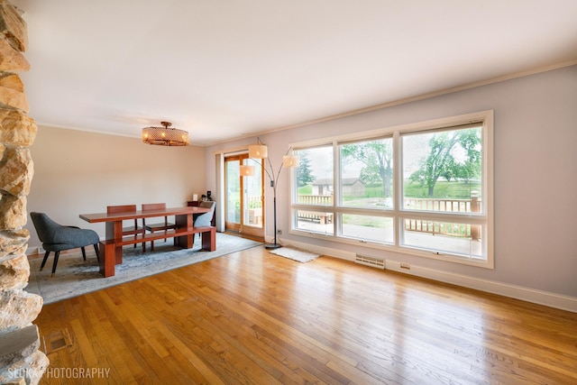 21W724 Park Ave, Lombard, IL 60148 - dining room featuring ornamental molding, wood finished floors, and a chandelier