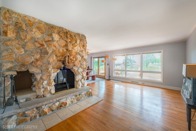 21W724 Park Ave, Lombard, IL 60148 - unfurnished living room featuring a fireplace, wood finished floors, and crown molding