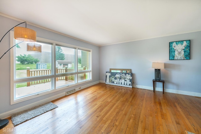 21W724 Park Ave, Lombard, IL 60148 - unfurnished living room with crown molding and wood finished floors