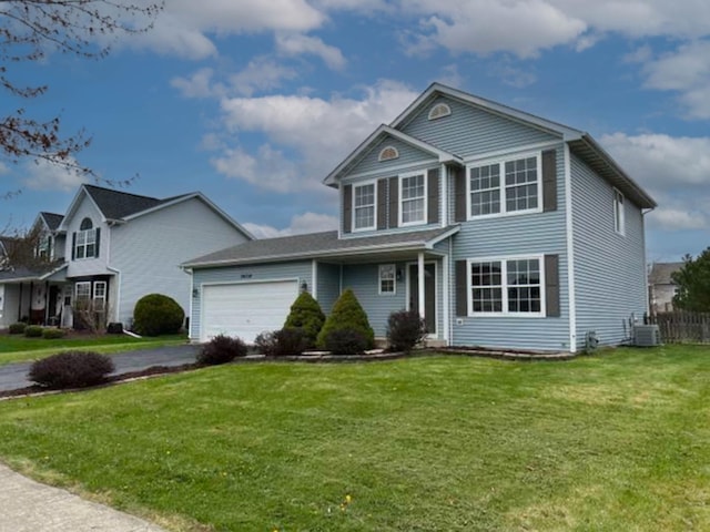 26518 W Deer Path, Channahon, IL 60410 - traditional home featuring a front lawn, a garage, and asphalt driveway