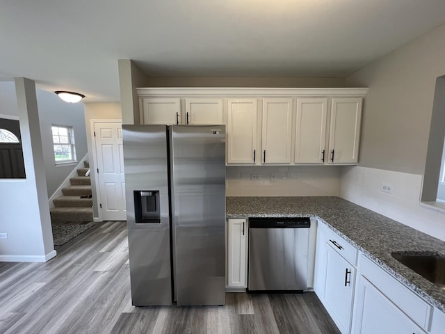 26518 W Deer Path, Channahon, IL 60410 - kitchen with stainless steel appliances, stone counters, wood finished floors, and backsplash