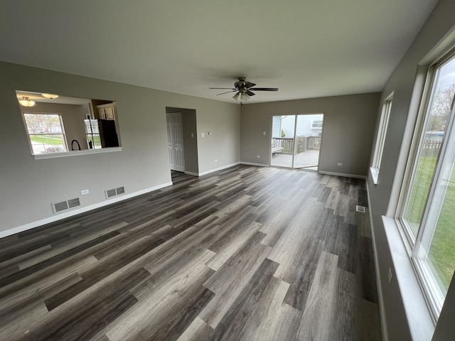 26518 W Deer Path, Channahon, IL 60410 - unfurnished living room with dark wood-style flooring and a ceiling fan