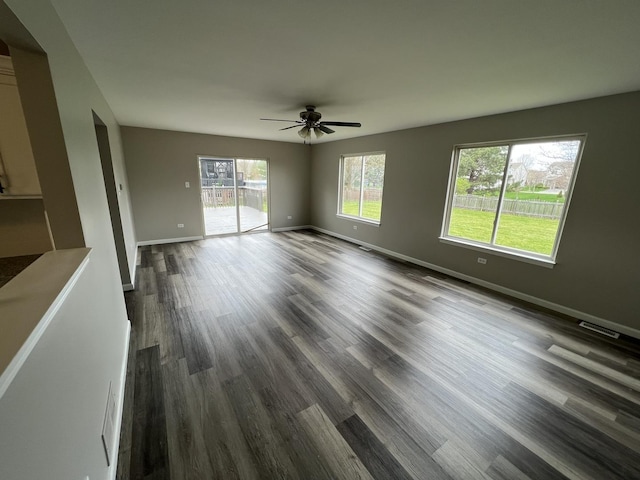 26518 W Deer Path, Channahon, IL 60410 - empty room with plenty of natural light, a ceiling fan, and dark wood-style floors