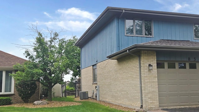 8543 Carriage Ln, Tinley Park, IL 60487 - view of side of property featuring brick siding, board and batten siding, and an attached garage