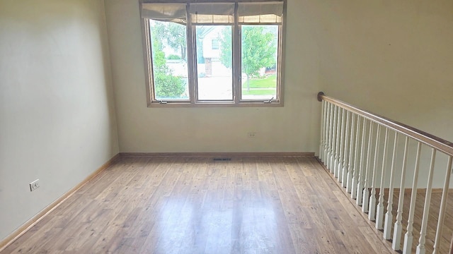 8543 Carriage Ln, Tinley Park, IL 60487 - spare room with light wood-style floors and baseboards
