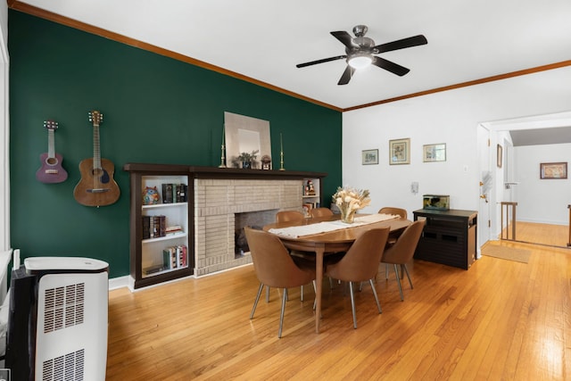 1252 W Pratt Blvd Unit 2, Chicago, IL 60626 - dining area featuring ornamental molding, hardwood / wood-style flooring, ceiling fan, and a brick fireplace