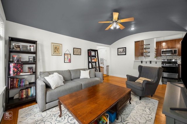 1252 W Pratt Blvd Unit 2, Chicago, IL 60626 - living area with vaulted ceiling, light wood-style flooring, and ceiling fan