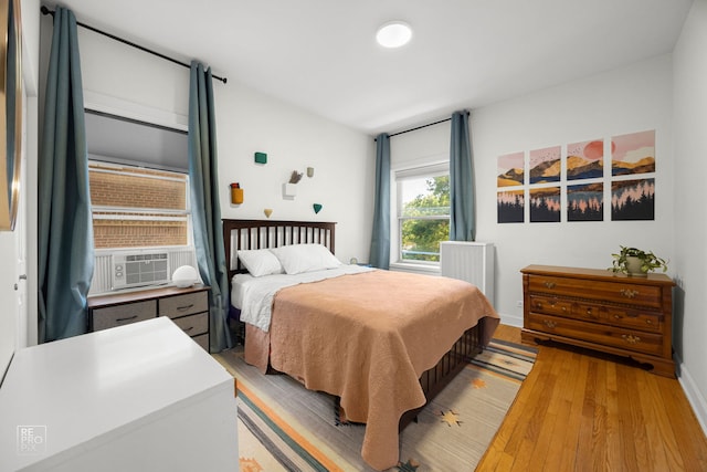 1252 W Pratt Blvd Unit 2, Chicago, IL 60626 - bedroom with light wood finished floors and cooling unit