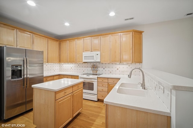 2365 Waukegan Rd Unit 2C, Northbrook, IL 60062 - kitchen with white appliances, light brown cabinets, light wood-style flooring, light countertops, and recessed lighting