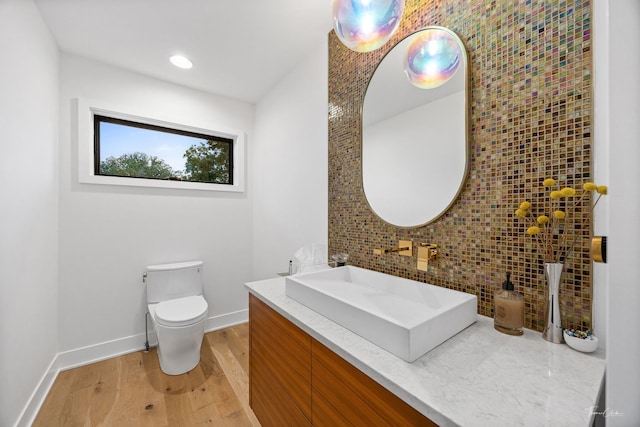 5401 Carpenter St, Downers Grove, IL 60515 - bathroom with wood finished floors, vanity, and decorative backsplash
